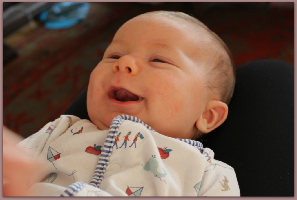 smiling baby boy first smile