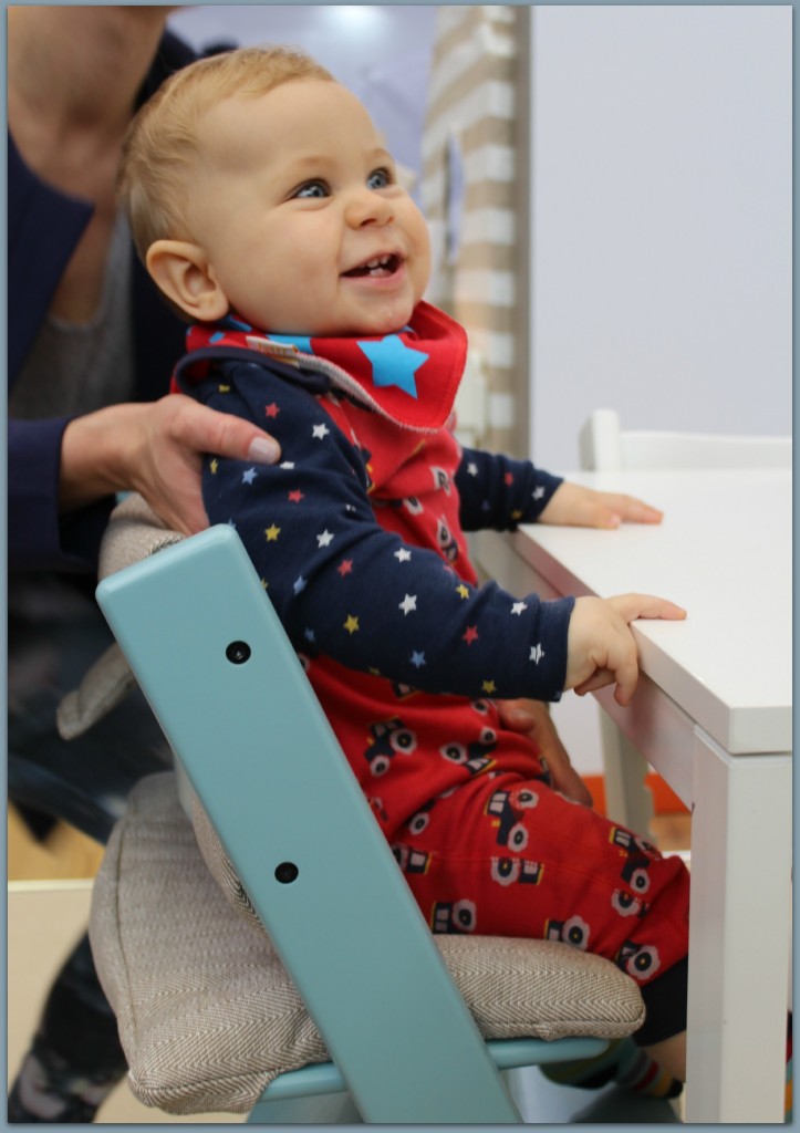 Caspian testing the classic Stokke chair at The Baby Show at Kensington Olympia