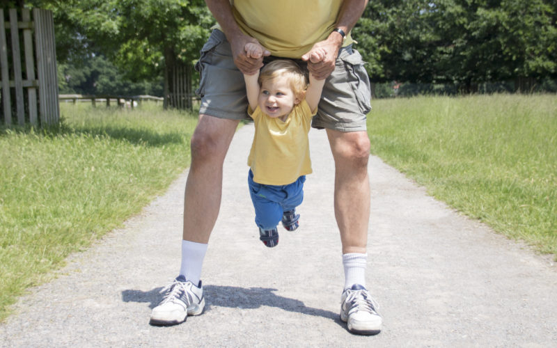 Caspian and Dady in matching yellow t-shirts having fun in the park!